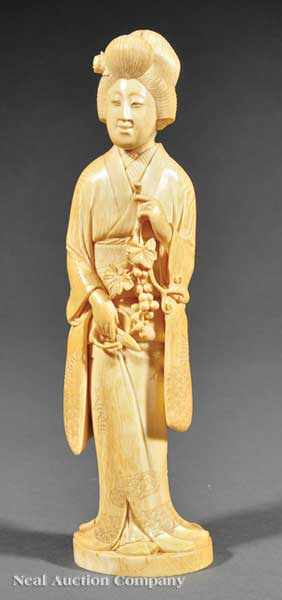 Appraisal: An Antique Japanese Carved Ivory Figure of a Bijin the