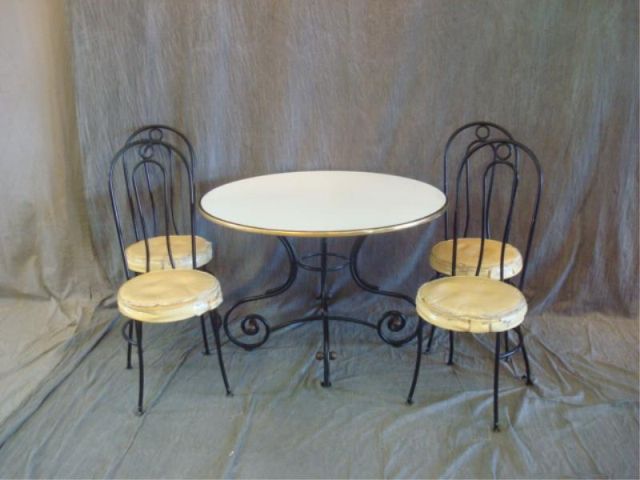 Appraisal: Neoclassical Style Metal Dinette Set Has chairs and a milk