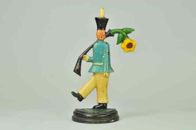 Appraisal: SOLDIER WITH FLOWER IN GUN DOORSTOP BOOK EXAMPLE '' ''