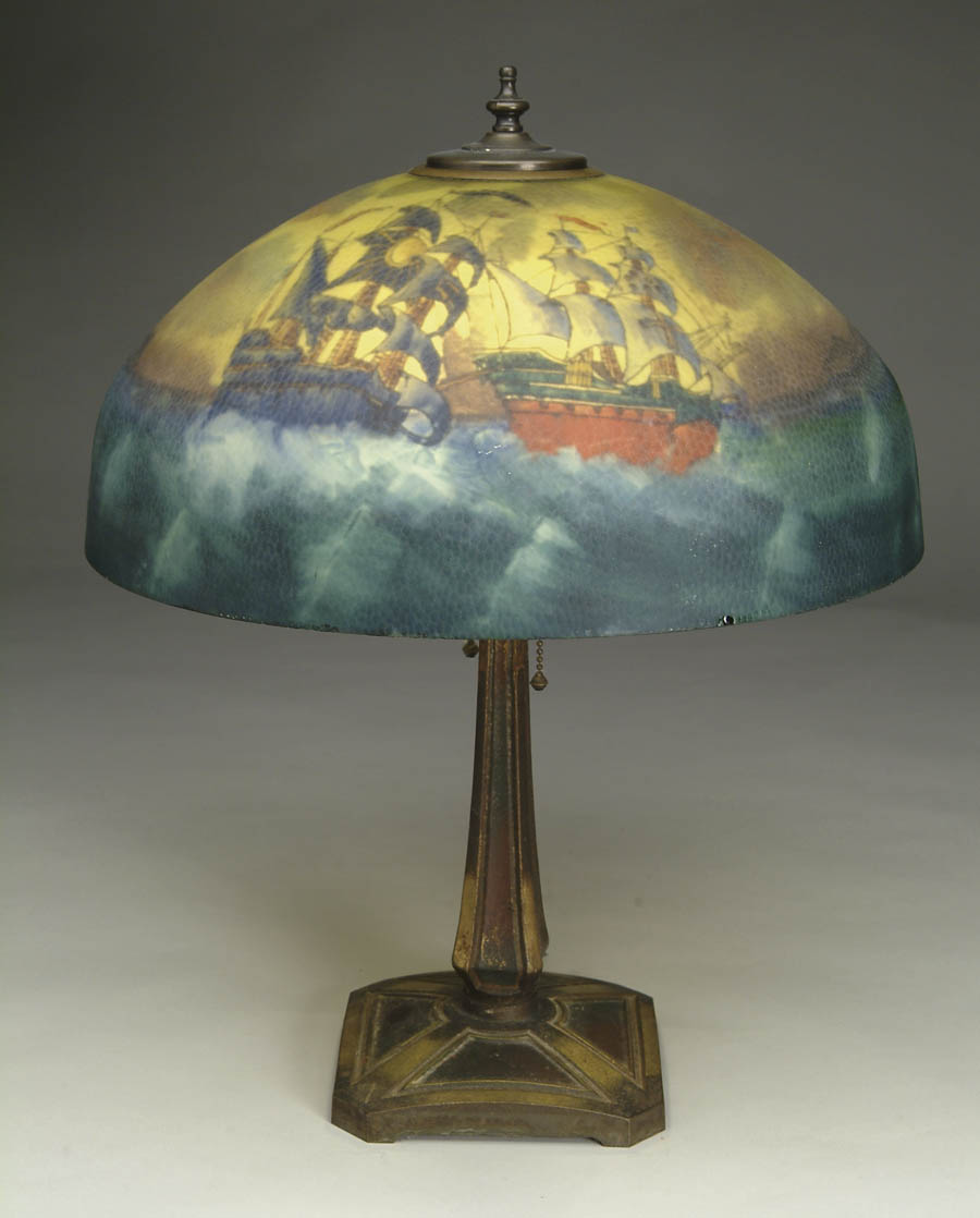 Appraisal: REVERSE PAINTED TABLE LAMP Stylized galleon decoration on yellow sky