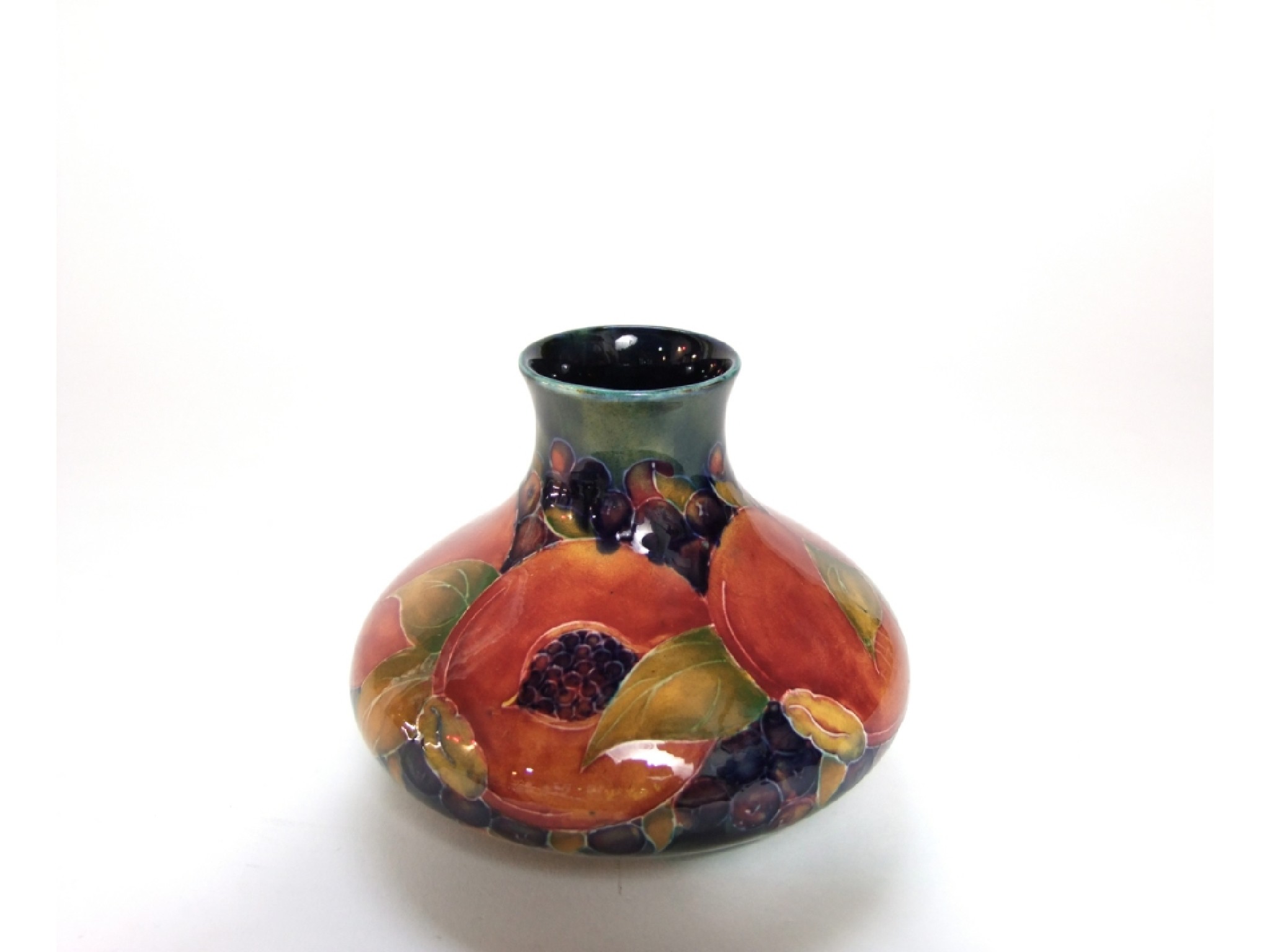 Appraisal: A Moorcroft Pottery vase of squat form with pomegranate decoration