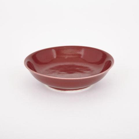 Appraisal: Xuande Mark Oxblood Glazed Dish With gently sloped sides and