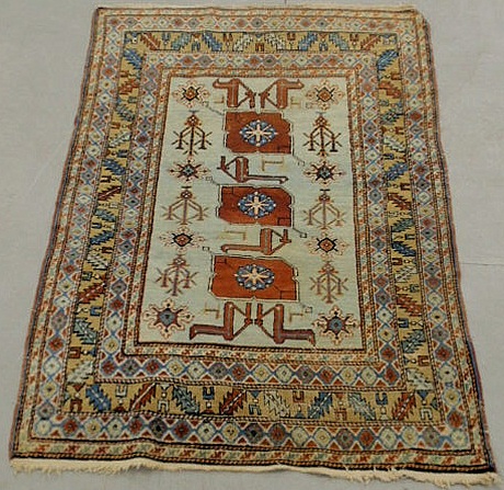 Appraisal: Kazak oriental mat blue field and stylized flowers and animals