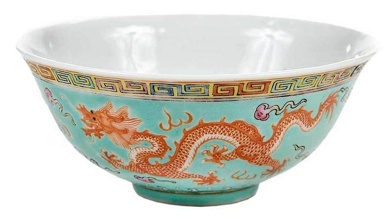 Appraisal: Chinese Phoenix Bowl phoenix and dragon scene orange reign mark