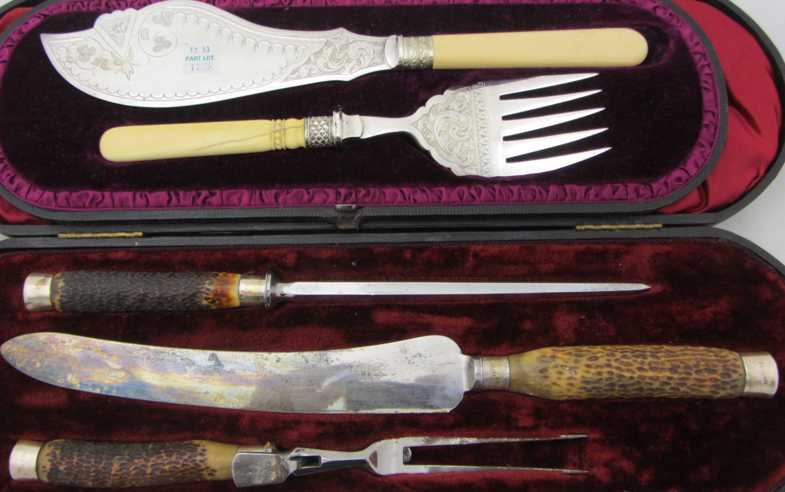 Appraisal: A pair of plated fish servers with engraved decoration cased