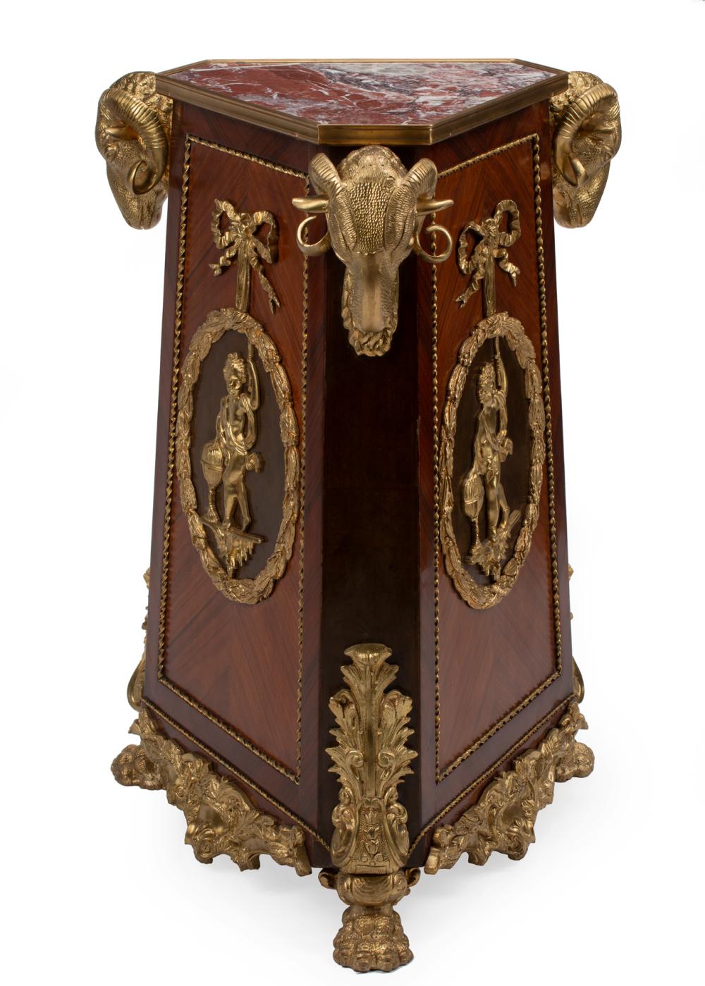 Appraisal: Empire-Style Bronze-Mounted Kingwood Triangular Pedestal inset rouge marble top ram's