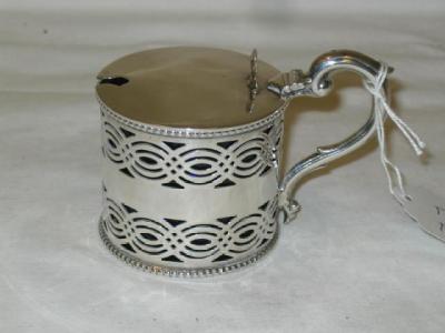 Appraisal: AN EDWARDIAN MUSTARD POT of cylindrical form pierced with waved