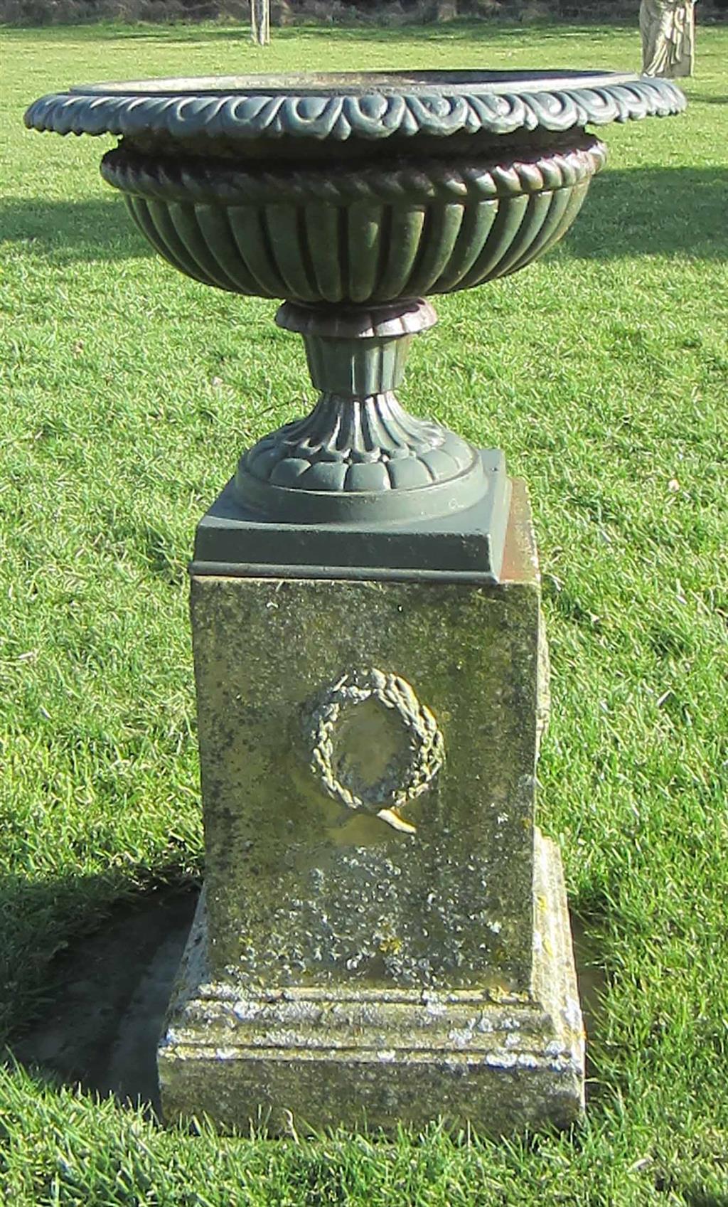 Appraisal: CAST IRON GARDEN URN AND FIRE CLAY PLINTH the urn