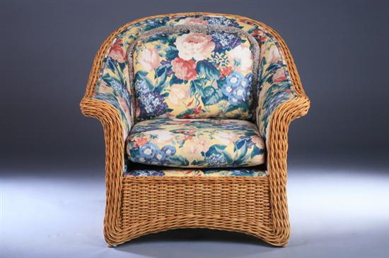 Appraisal: WOVEN WICKER OVER-SIZED CLUB CHAIR late th century With floral-upholstered