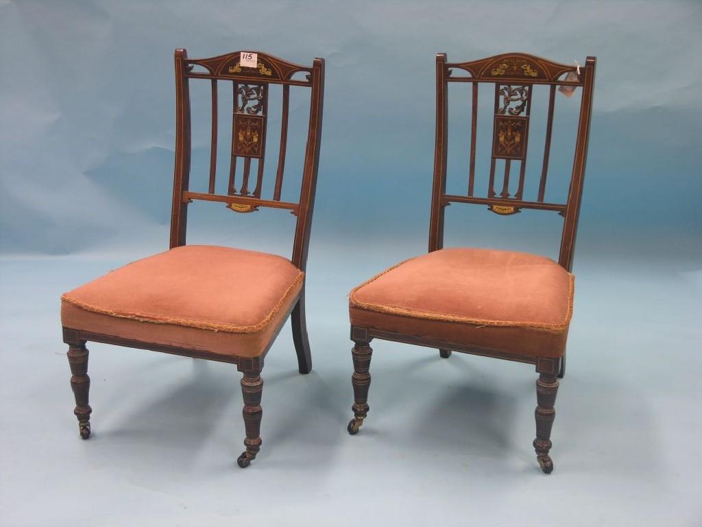 Appraisal: A pair of Edwardian inlaid rosewood nursing chairs with upholstered