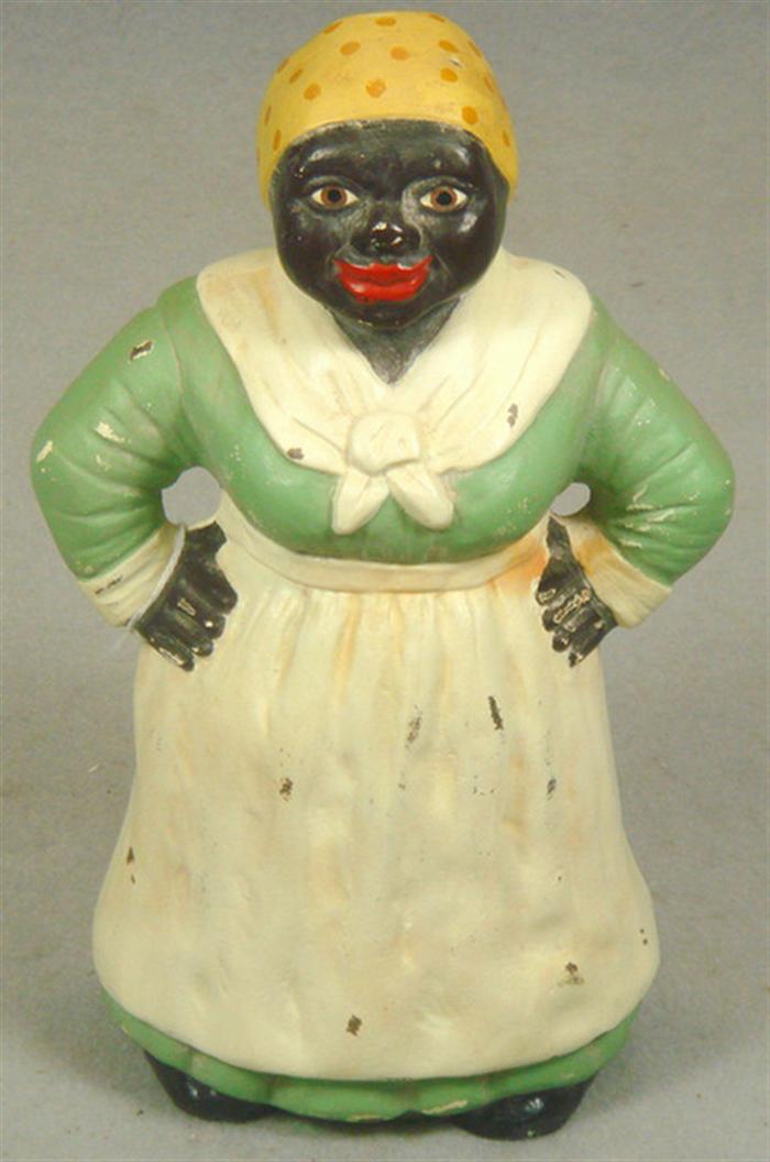 Appraisal: Cast iron doorstop hollowed Mammy figure with apron and bandanna