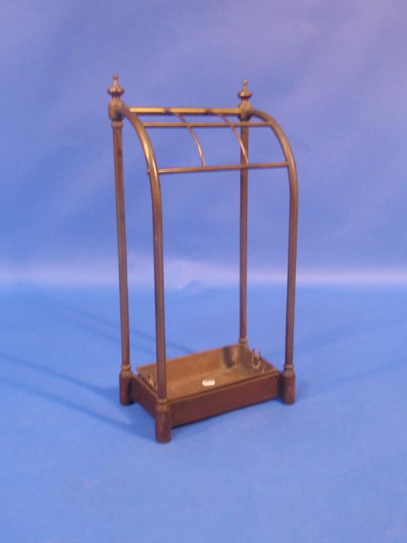 Appraisal: A Victorian brass and steel umbrella and stick stand