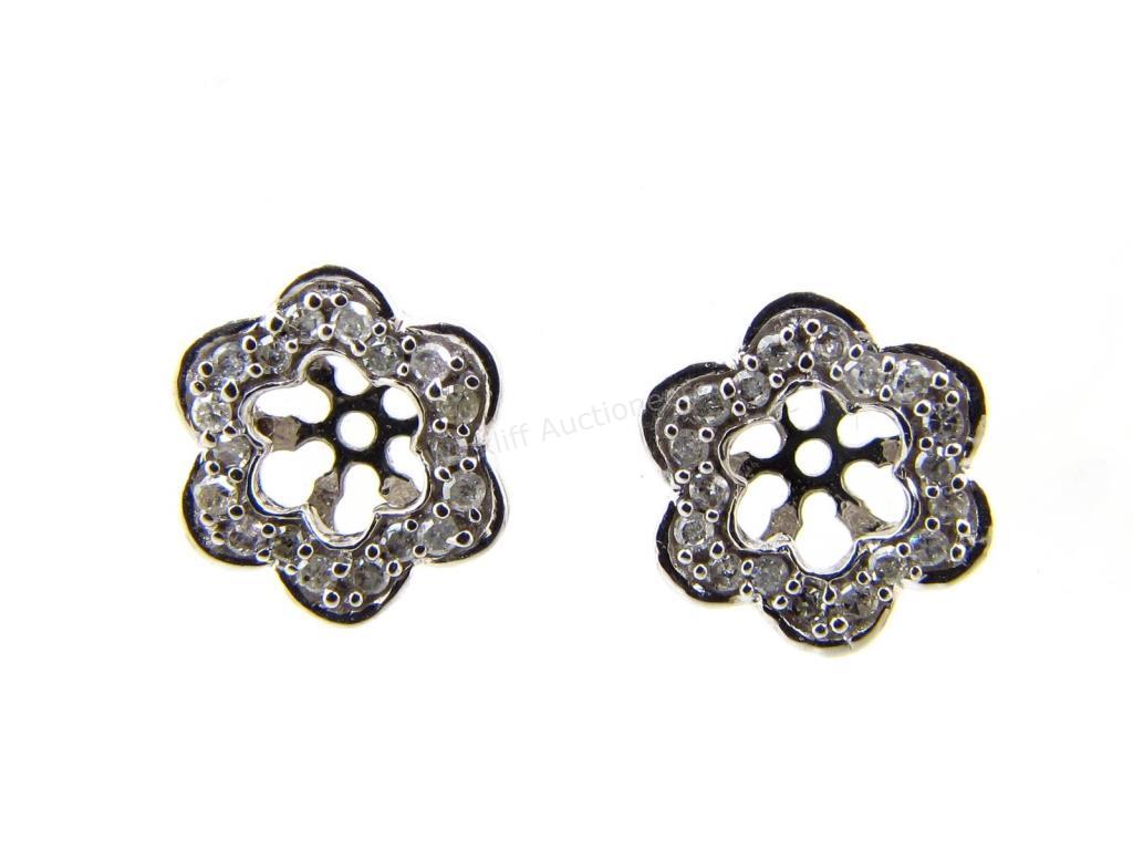 Appraisal: A pair of K white gold flower design diamond earring