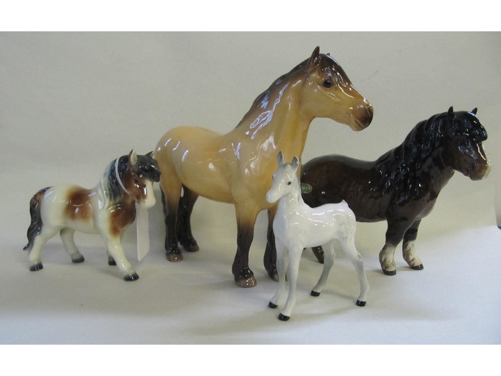 Appraisal: Three Beswick figures of horses and a Goebel horse to