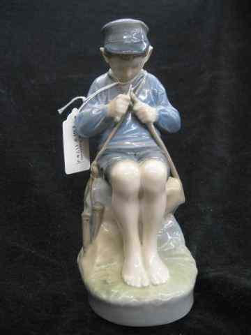 Appraisal: Royal Copenhagen Porcelain Figurine seated boy at work '' excellent