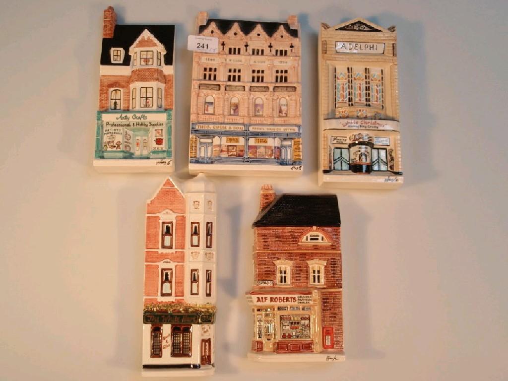 Appraisal: Five nation of shopkeepers ceramic wall plaques