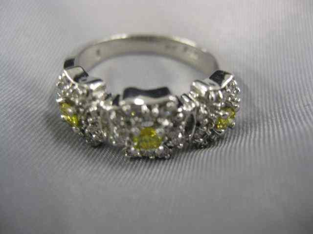 Appraisal: Platinum Diamond Ring yellow diamonds surrounded by round white diamonds