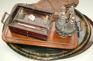 Appraisal: A th century mahogany roll top desk inkstand fitted with