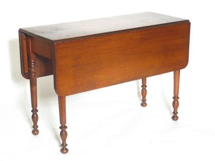 Appraisal: Federal cherry drop leaf table circa With ring-turned and tapering