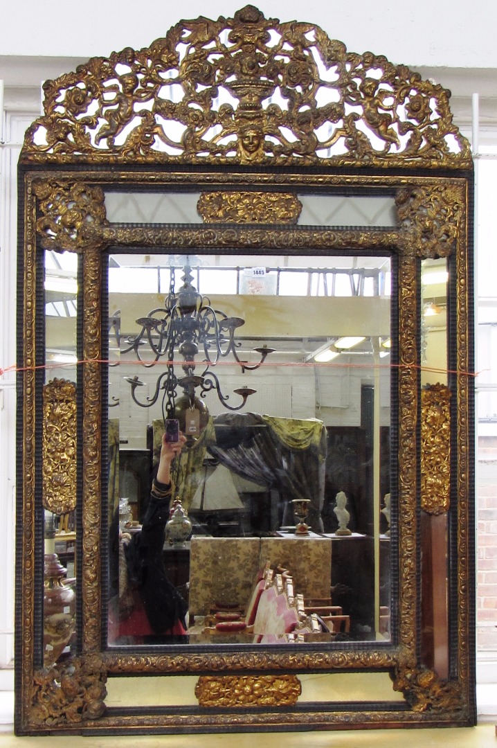 Appraisal: A th century Dutch repousse wall mirror the upper frieze