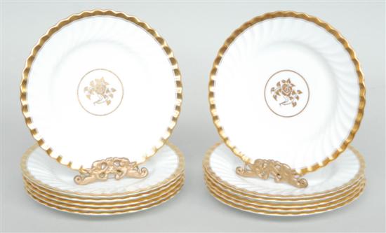 Appraisal: A SET OFTWELVE MINTON BREAD PLATES With gold rims and