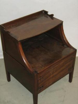 Appraisal: A GEORGE III BEDSIDE COMMODE the raised galleried back with