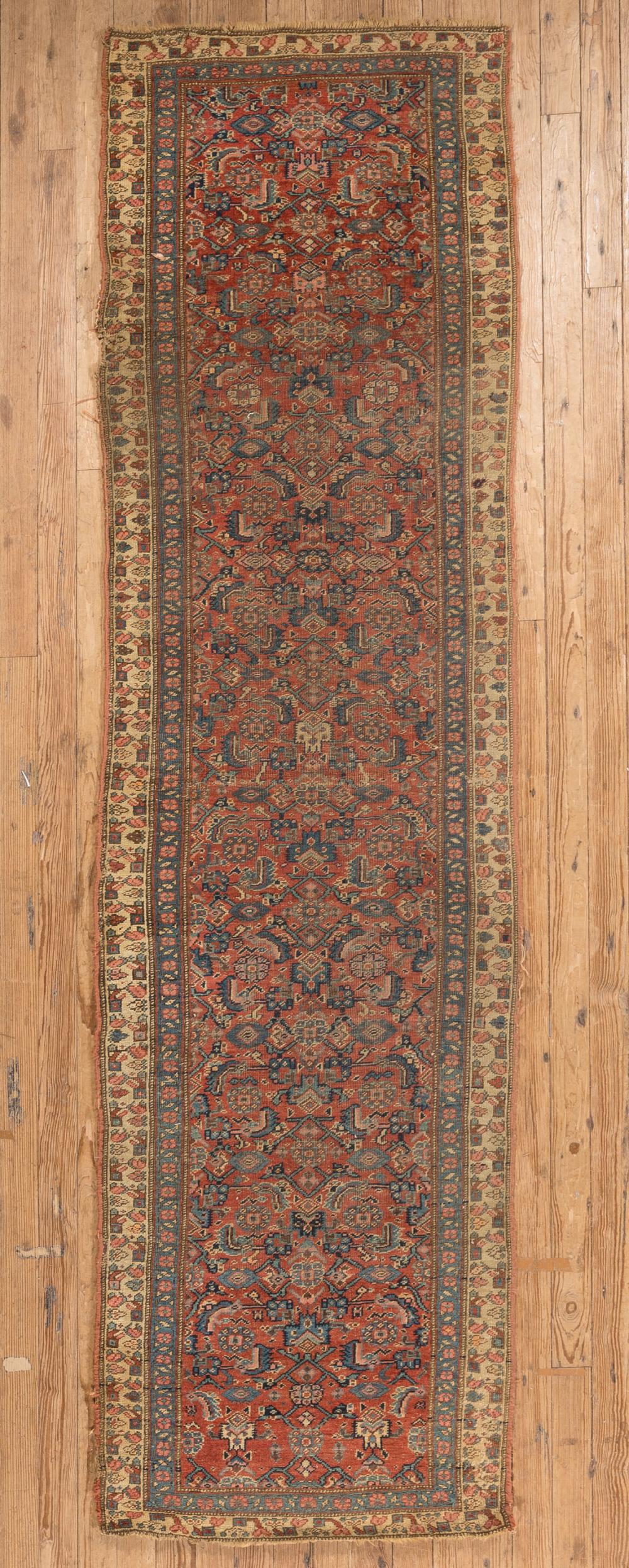 Appraisal: Antique Persian Runner red ground repeating foliate design ft x