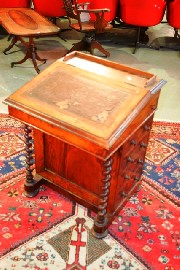 Appraisal: An Edwardian mahogany davenport with tooled leather inset with birds-eye