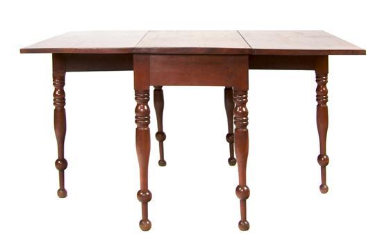 Appraisal: An American Cherry Drop-Leaf Table having rectangular top and leaves