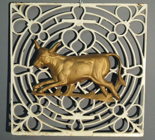 Appraisal: Cast iron running bull figure mounted on a square open