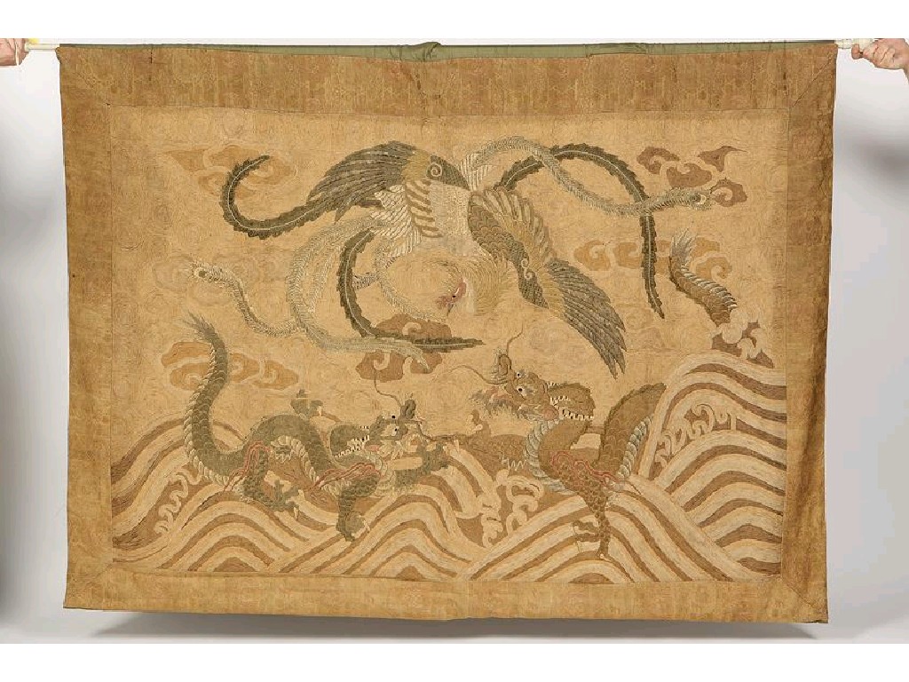 Appraisal: A JAPANESE TEXTILE HANGING embroidered with scaly dragons and phoenix