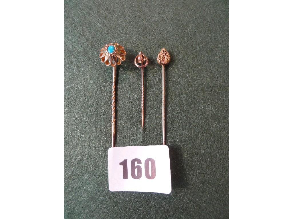 Appraisal: A Victorian stick pin with stylised turquoise setting a further