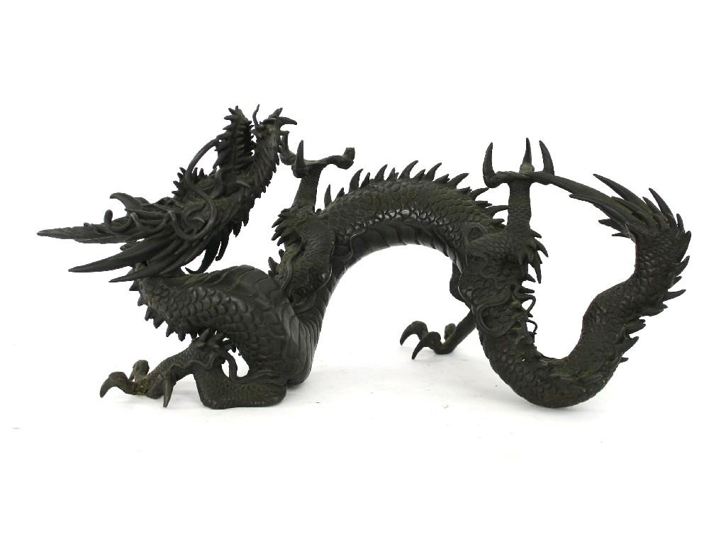 Appraisal: Oriental bronze dragon well cast with scaled body and twisting