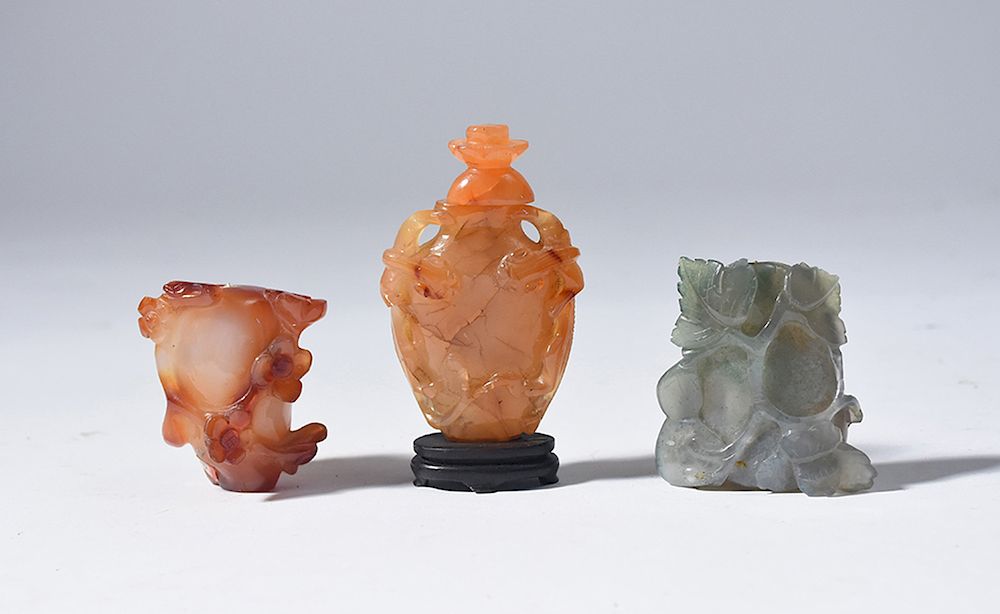 Appraisal: Three hardstone snuff bottles Three hardstone snuff bottles carnelian and