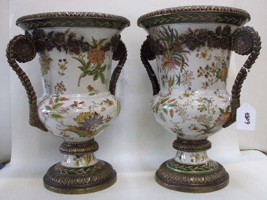 Appraisal: Pair of reproduction ceramic urns with gilt metal mounts