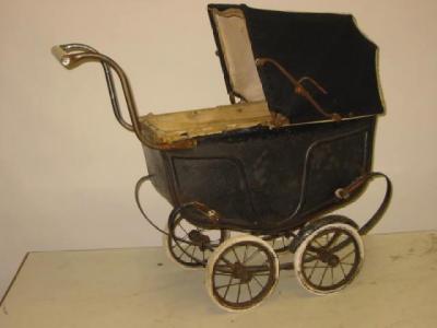 Appraisal: An early th century dolls pram painted tin construction with