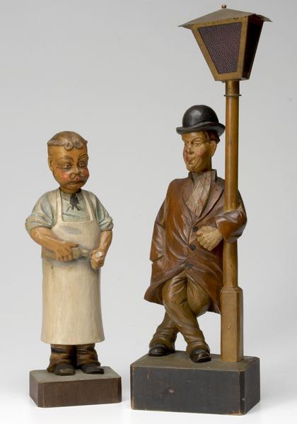 Appraisal: GERMAN FOLK ART German hand-carved wooden Whistlers of a grocer