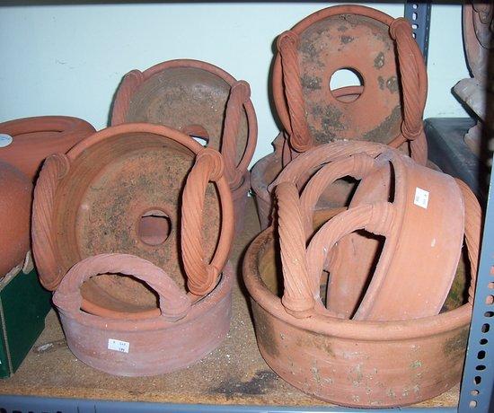 Appraisal: Nine terracotta two-handled jardini res