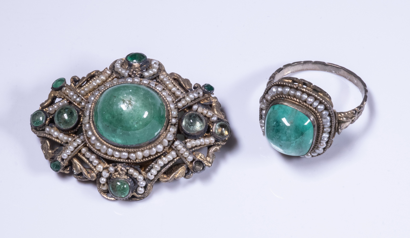 Appraisal: RENAISSANCE ERA GILT SILVER AND EMERALD OVAL BROOCH Set with