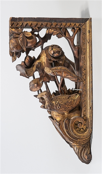 Appraisal: Carved gilt wood corbel depicting tree branches with a bird