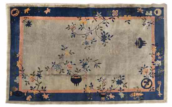 Appraisal: A Chinese Wool Rug having an urn issuing flowering branches