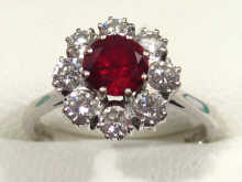 Appraisal: A diamond and ruby cluster ring set in carat white