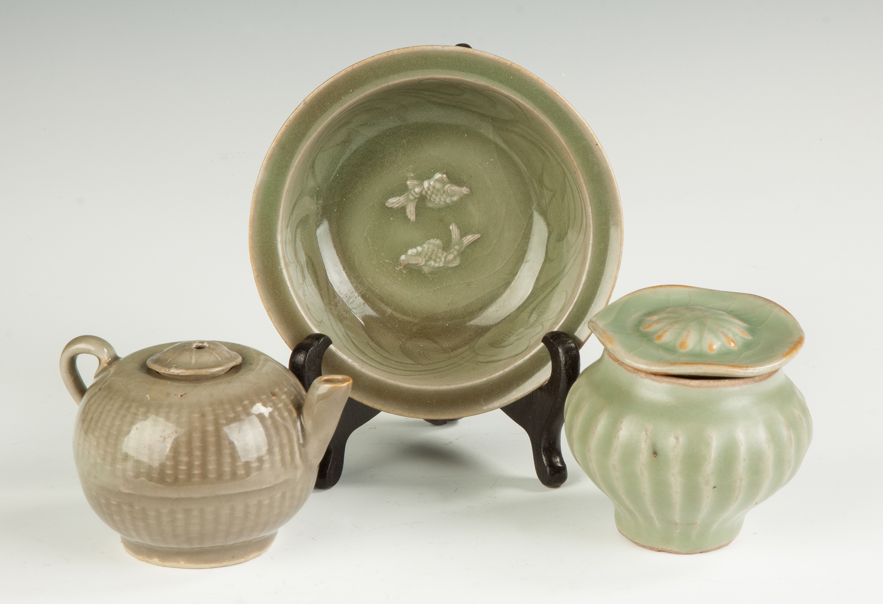 Appraisal: Three Celadon Pieces Teapot Bowl with coi Covered jar