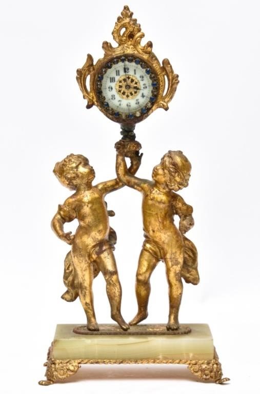 Appraisal: French gilted white metal Putti clock with green onyx base