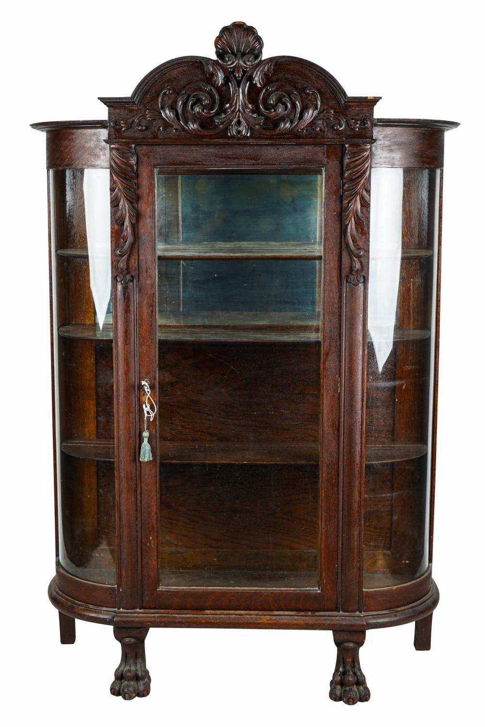 Appraisal: AMERICAN CARVED OAK VITRINE CABINET th century the glazed hinged