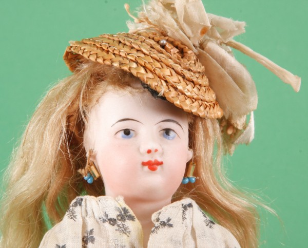 Appraisal: F G solid dome shoulderhead doll with painted blue eyes