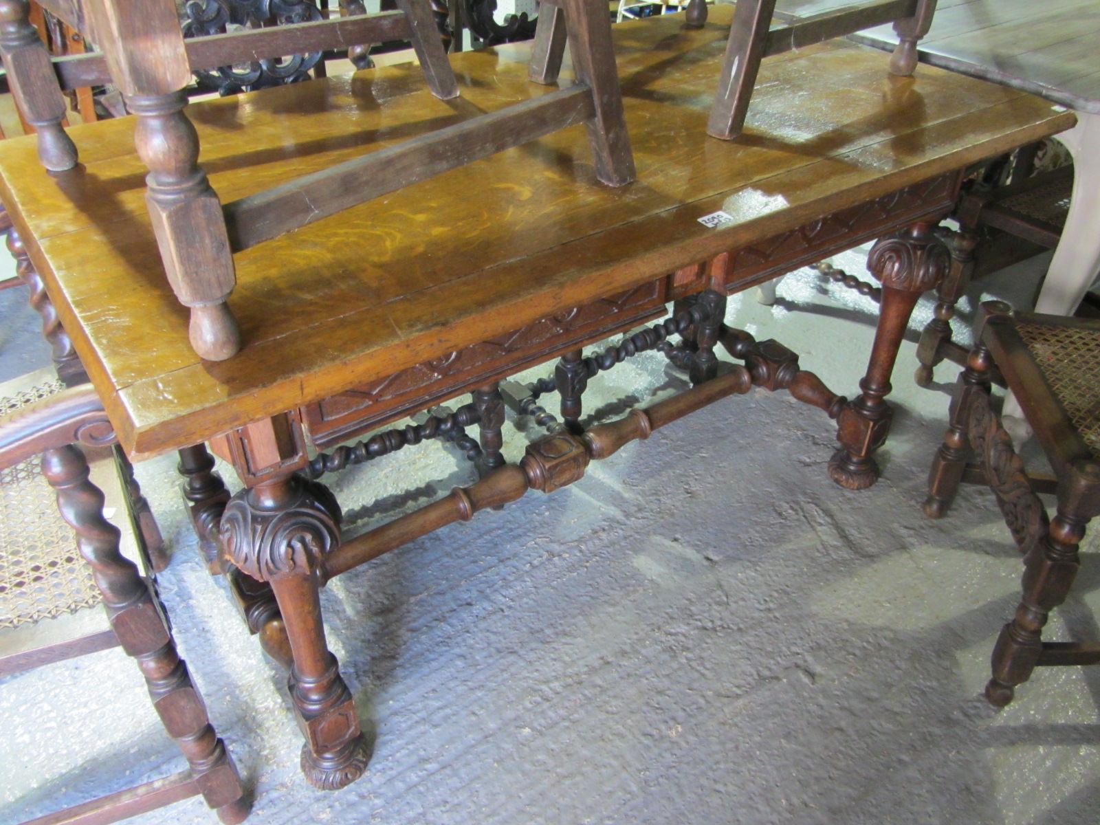 Appraisal: A th century carved oak side table with turned carved