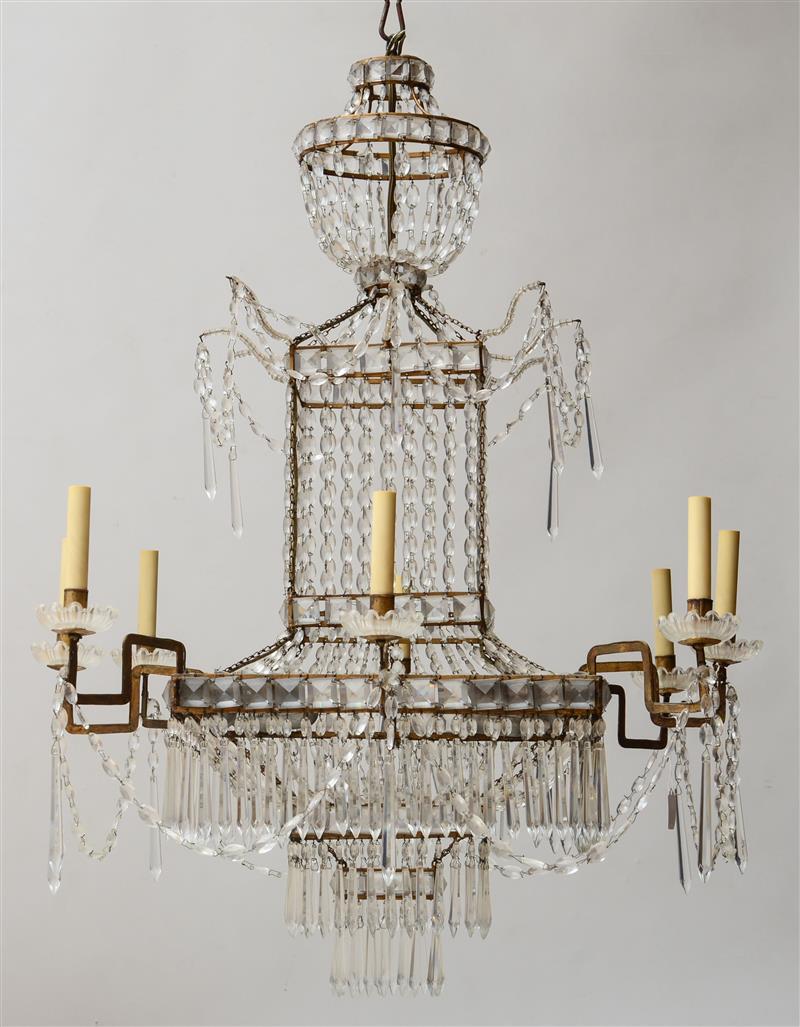 Appraisal: EMPIRE STYLE CUT-GLASS AND GILT-METAL EIGHT-LIGHT CHANDELIER The square prism-hung