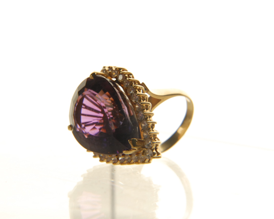 Appraisal: A Gold Amethyst and Diamond Cocktail Ring K marked yellow