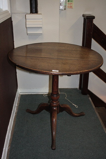 Appraisal: A TH CENTURY OAK TIP-UP CIRCULAR OCCASIONAL TABLE on tripod